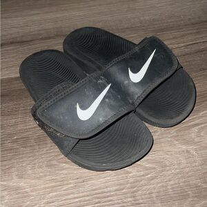 Used kids size 12c Nike slides